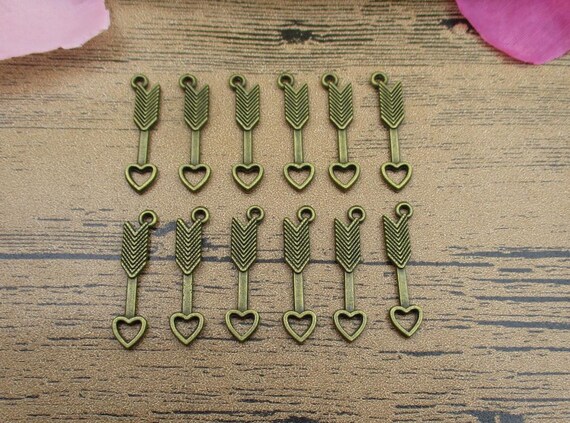 10 Arrow charms antique bronze tone BC1