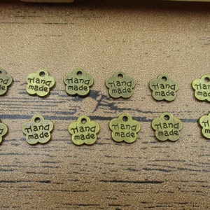 50 amuletos feitos à mão, tom de bronze antigo, dupla face, etiqueta com letras-RS351