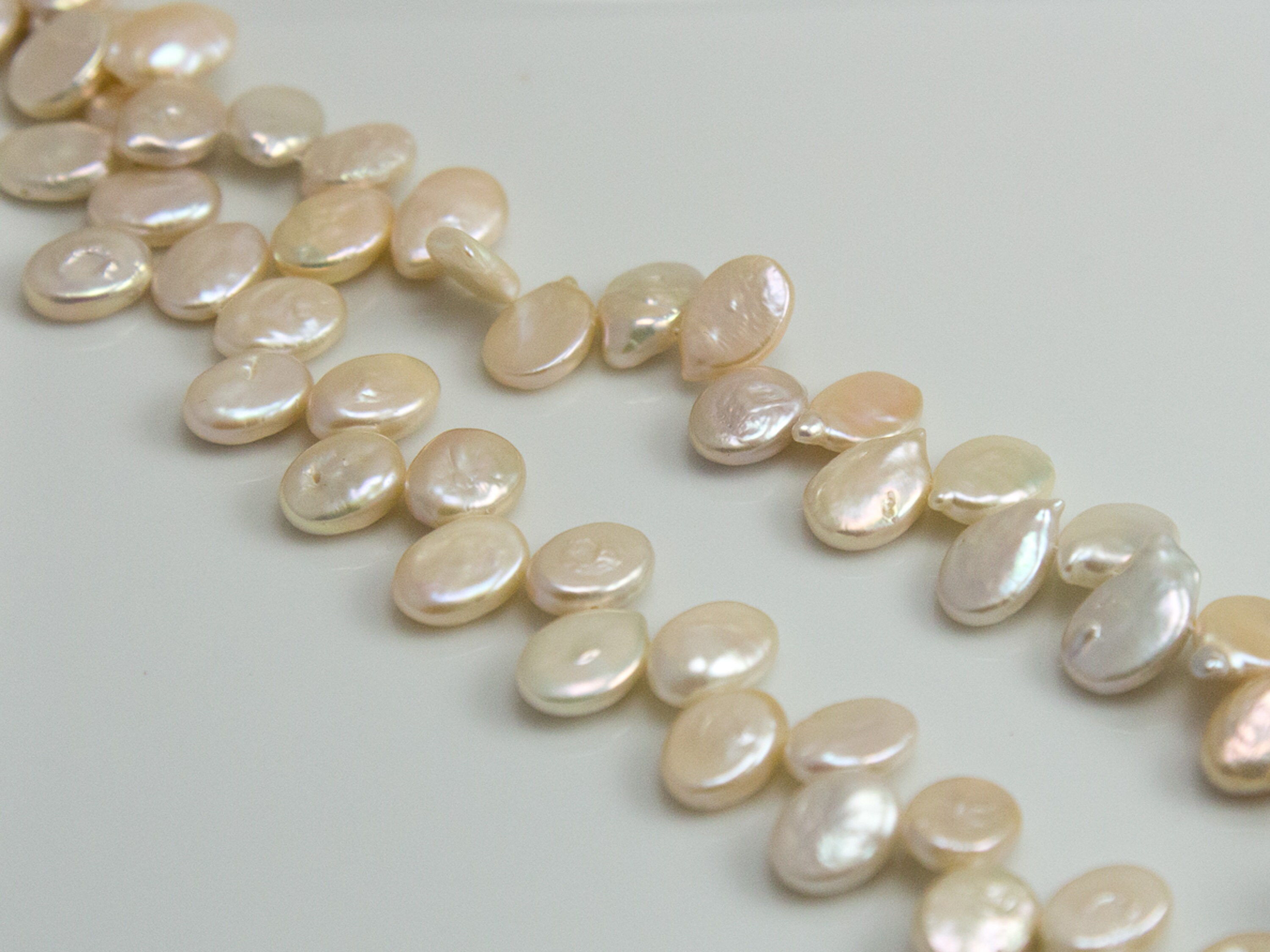 white flats with pearls