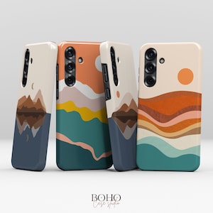 May include: Four phone cases with landscape designs. Each case features a different color palette, including shades of blue, orange, and beige, with mountain and sun illustrations. The cases have a glossy finish and a camera cutout. The text "BOHO Case studio" is at the bottom.