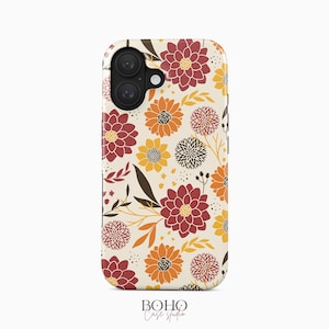 May include: A phone case featuring a cream-colored background with a repeating pattern of flowers in shades of deep red, orange, and yellow, accented by dark brown leaves and small black dots. The case has a black camera cutout at the top left.