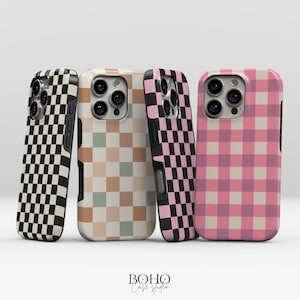 May include: Four phone cases with checkerboard patterns in black and white, beige and green, pink and black, and pink and white. The cases are arranged in a row, showcasing a variety of designs. The brand name "BOHO Case studio" is at the bottom.