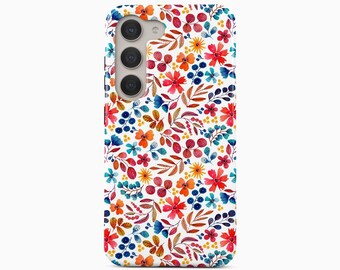 May include: A white smartphone case featuring a vibrant watercolor pattern of various flowers, leaves, and berries in shades of red, orange, yellow, and blue. The case includes a cutout for a triple-lens camera system on the upper left side.