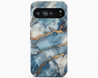 May include: A smartphone case featuring a blue and white marble pattern with gold veining throughout. The case has a black horizontal camera cutout at the top, revealing three circular camera lenses and a flash. The text BOHO Case studio is visible.