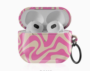 May include: Pink and beige swirl pattern phone case with a black ring attached. The case is open and shows the white AirPods inside.