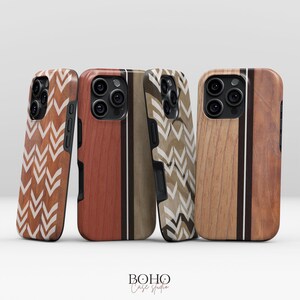 May include: Four wooden phone cases with unique designs. Two cases feature a chevron pattern in brown and white, while the other two have vertical wood grain with accent stripes. The cases are from Boho Case Studio.