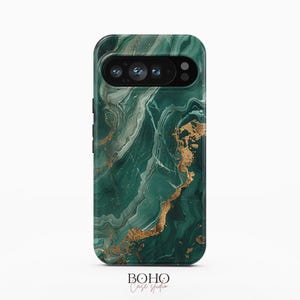 May include: A smartphone case featuring a deep emerald green marble pattern with swirling white veins and metallic gold accents. The case has a black camera cutout section at the top and the text BOHO Case studio printed at the bottom center.