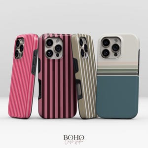 May include: Four phone cases with striped designs in pink, burgundy, tan, and teal. The cases have vertical stripes, except for the teal case, which has horizontal stripes. The cases are from Boho Case Studio.