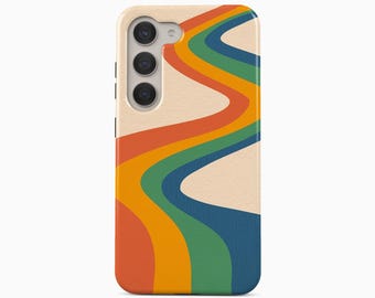 May include: A mobile phone case featuring a cream-colored background with wavy, vertical stripes in shades of orange, yellow, green, and dark blue. The case has a triple-lens camera cutout on the upper left side and the text Boho Case Studio below.