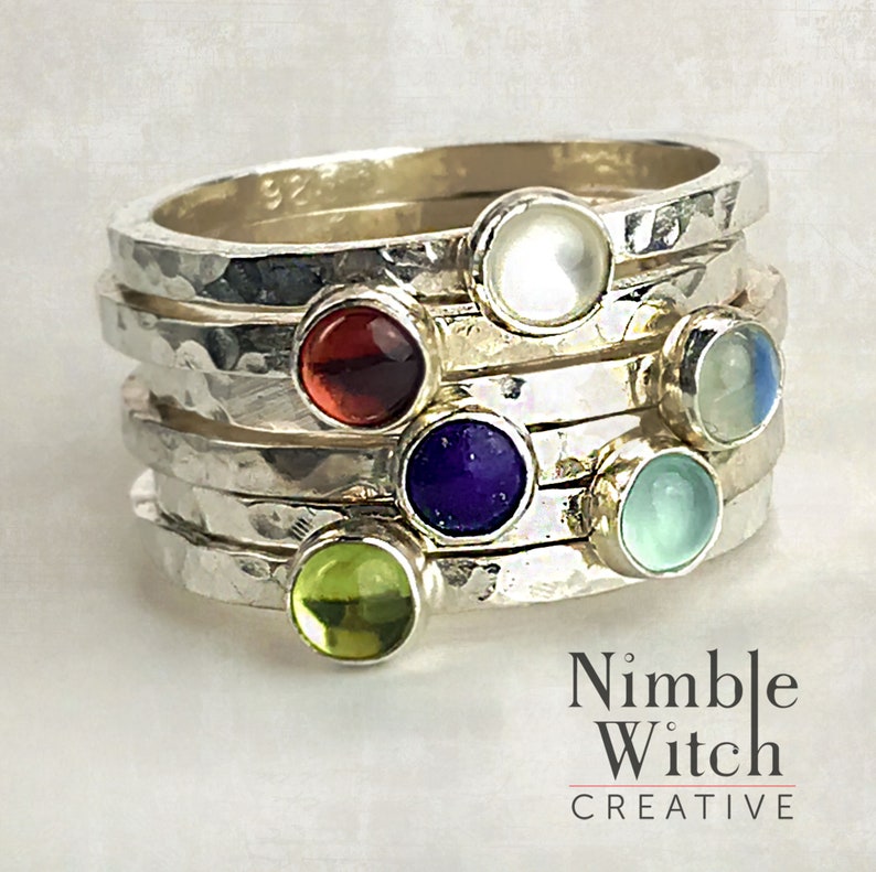 Six stacking rings with 4mm natural birthstones. Rings are made of hammered,14 gauge, square, sterling silver. In this set is a Garnet, Mother of Pearl, Peridot, Lapis, Moonstone, and Aqua Chalcedony.