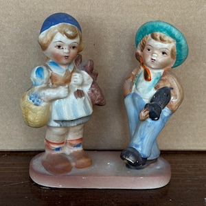 Vintage boy and girl ceramic figurine made in Japan.
