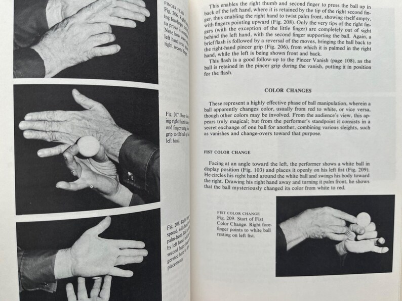 May include: Black and white images from a book on magic tricks. The images show hands manipulating a small white ball. Text describes the steps for various illusions, including color changes and vanishing acts.