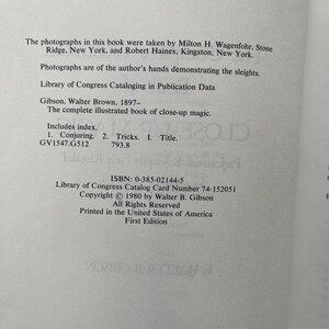 May include: Open book page with text about a book on close-up magic. The text includes the title, author, Library of Congress data, and ISBN. The book was printed in the United States of America.