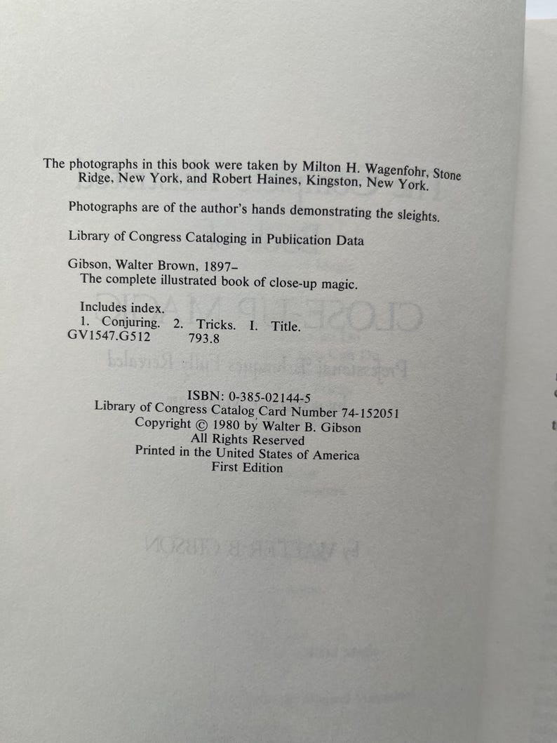 May include: Open book page with text about a book on close-up magic. The text includes the title, author, Library of Congress data, and ISBN. The book was printed in the United States of America.