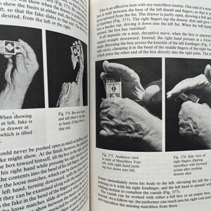 May include: Black and white images from a book detail a matchbox magic trick. The illustrations show hands manipulating the matchbox, with text describing the steps and angles for the illusion. The images are labeled with figure numbers.