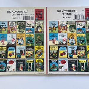 May include: A collection of vintage "The Adventures of Tintin" comic books by Herg&eacute;. The covers feature colorful illustrations and titles like "Tintin in America," "The Black Island," and "Destination Moon."