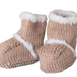 May include: A pair of brown knitted baby booties with white faux fur trim. The booties are made of a soft, warm material and are perfect for keeping little feet cozy.