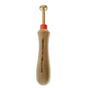 May include: A brass tool with a wooden handle and a red tip. The tool is used for making holes in leather or fabric.