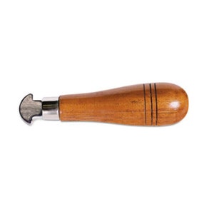 May include: A wooden-handled tool with a metal blade, used for cutting leather or fabric.