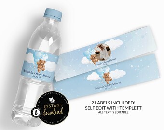 May include: Two blue and white baby shower water bottle labels with a teddy bear holding balloons. The labels feature a cloud background with white snowflakes. The text on the labels reads "Amanda's Baby Shower 01.24.22".