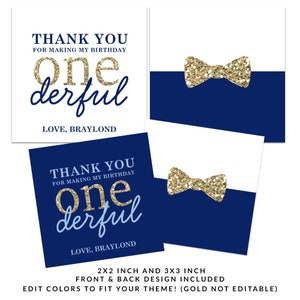 May include: Two printable thank you cards for a first birthday party. The front of the card features a gold glitter bow tie on a navy blue background. The back of the card has the text "Thank you for making my birthday one derful. Love, Braylond" in gold and blue text on a white background.
