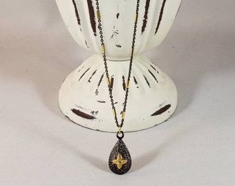 Sterling and Vermeil Necklace adorned with a diamond pendant