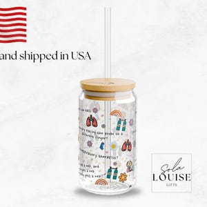 May include: A clear glass reusable water bottle with a bamboo lid and a straw. The bottle is decorated with a colorful design featuring a rainbow, lungs, and the text "I'm only taking the probe on a wilderness emergency."  The bottle is printed with the text "Sola Louise Gifts".