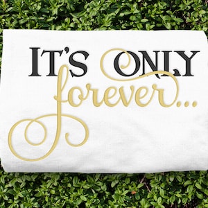 May include: White t-shirt with black text that reads "IT'S ONLY" and gold text that reads "forever..."