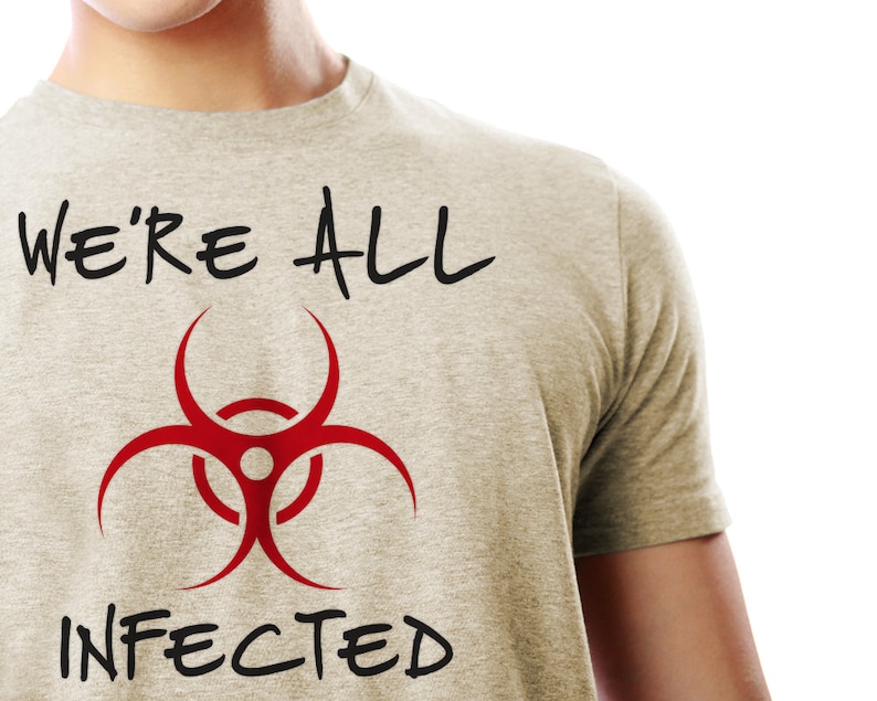 May include: A grey t-shirt with the text "WE'RE ALL" and a red biohazard symbol with the text "INFECTED" underneath.