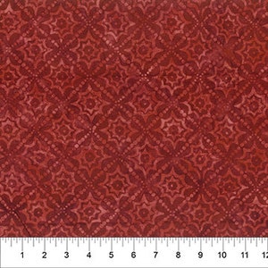 May include: Red fabric with a repeating pattern of white and light red diamond shapes with a floral design.