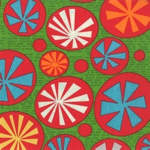 May include: Green fabric with a repeating pattern of red, white, blue, and orange circles with a sunburst design. The circles are on a green background with a newspaper print.