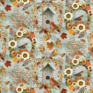 May include: A seamless pattern featuring wreaths of fall foliage, sunflowers, and birds. The wreaths are decorated with small pumpkins, berries, and leaves. The background is a light blue woodgrain pattern.