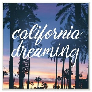 May include: A sunset scene with palm trees silhouetted against a purple and orange sky. The text "california dreaming" is written in white cursive font.