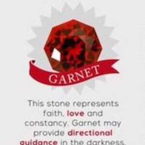 May include: A red garnet gemstone with a white starburst behind it. The text "JANUARY" and "GARNET" are displayed in white. The text below the gemstone reads: "This stone represents faith, love and constancy. Garnet may provide directional guidance in the darkness, making it ideal for frequent travellers."