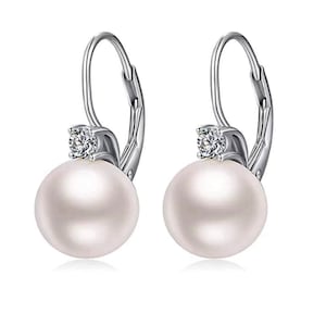 May include: A pair of silver hoop earrings with a single pearl and a small clear rhinestone on each earring.