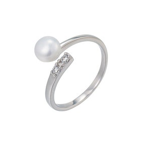 May include: A silver ring with a single white pearl and three small clear cubic zirconia stones.