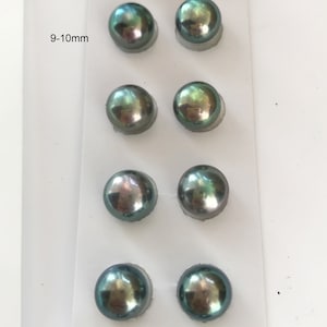 May include: Eight round, iridescent green pearls in a white card with the text "9-10mm".