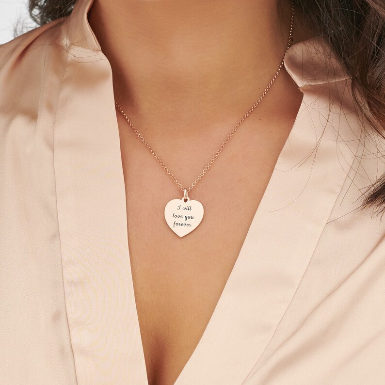 May include: A rose gold necklace with a heart-shaped pendant that says "I will love you forever".