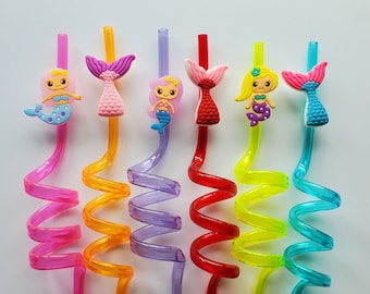 May include: Set of six colorful, spiral straws with mermaid-themed toppers. The toppers are pink, purple, and blue with a mermaid design. The straws are pink, orange, purple, red, yellow, and blue.