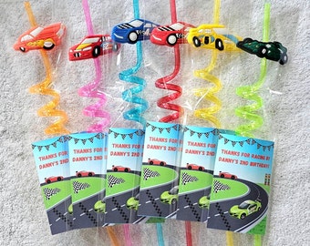 May include: Six colorful, spiral straws with attached car-shaped toppers. Each straw is packaged with a small card that says "Thanks for racing by Danny's 2nd birthday!"