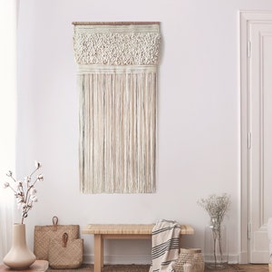 Elegant large woolen woven wall hanging finished with long tassels, neutral boho modern woven tapestry in metropolitan cottage style