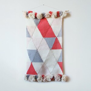 Circus woven wall art in a diamond pattern in pastel colors