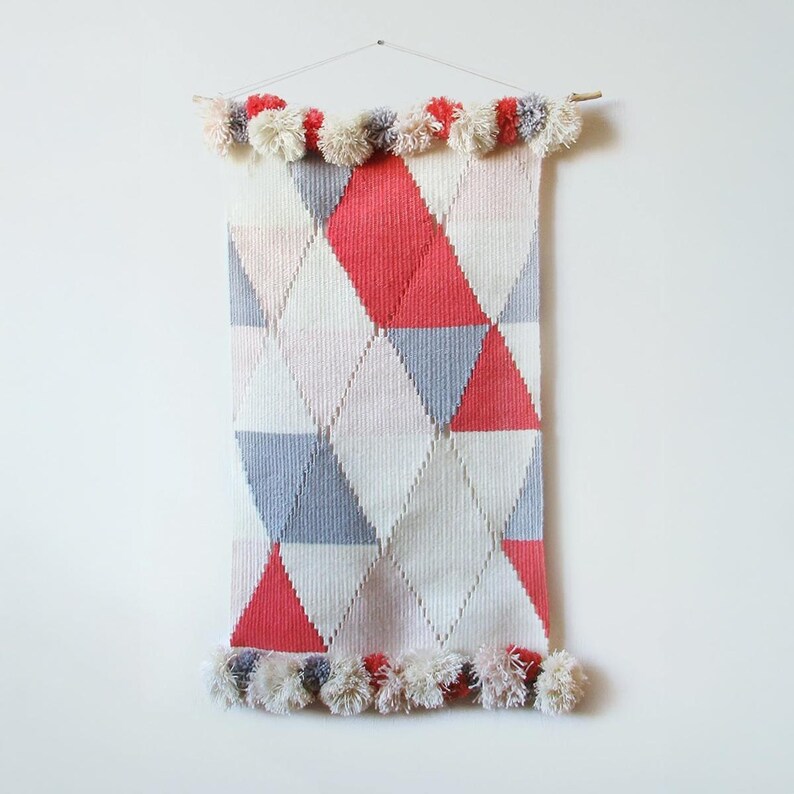 Circus woven wall art in a diamond pattern in pastel colors