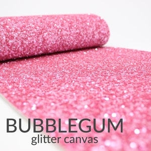 May include: Pink glitter canvas fabric roll with the text "BUBBLEGUM glitter canvas" printed on the fabric.