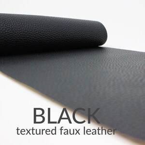 May include: A roll of black textured faux leather.