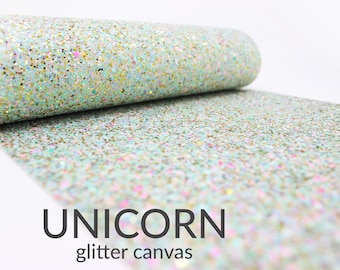 May include: A roll of light blue glitter canvas with a white background. The canvas is covered in iridescent glitter and has a subtle shimmer. The text "UNICORN glitter canvas" is printed on the bottom of the image.