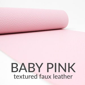 May include: A roll of baby pink textured faux leather.