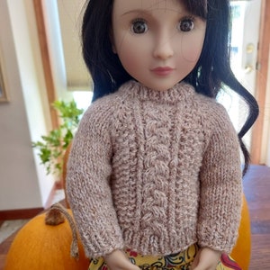 Doll sweaters for 16 inch dolls using a sustainable yarn blend. Created from Karina's Cozy Sweater Pattern found at PixieFaire.com.