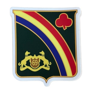 May include: A green and gold shield with a red clover, a yellow and blue diagonal stripe, and a gold crest with the number 69.