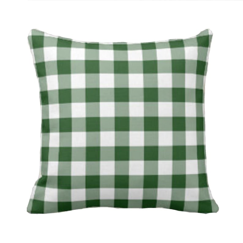 May include: Green and white checkered throw pillow. The pillow is made of a soft, comfortable fabric and has a subtle sheen.
